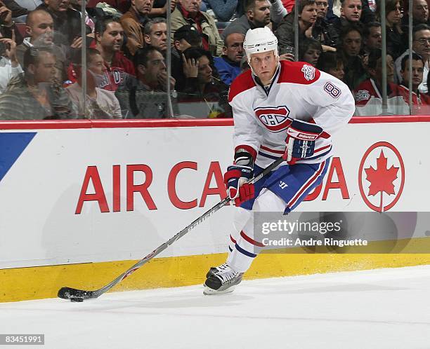 Mike Komisarek of the Montreal Canadiens stickhandles the puck against the Florida Panthers at the Bell Centre on October 20, 2008 in Montreal,...