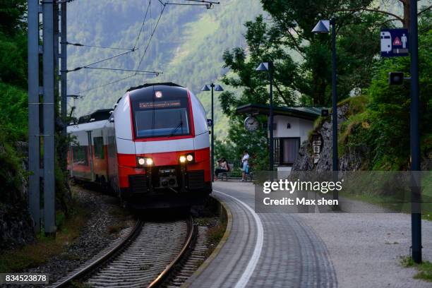 a train is passing by the railway station - upper austria stock pictures, royalty-free photos & images