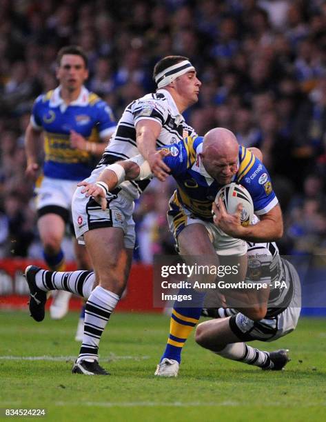 Leeds Rhinos' Keith Senior is tackled by Hull FC's Danny Houghton and Todd Byrne during the engage Super League match at Headingley Carnegie, Leeds.