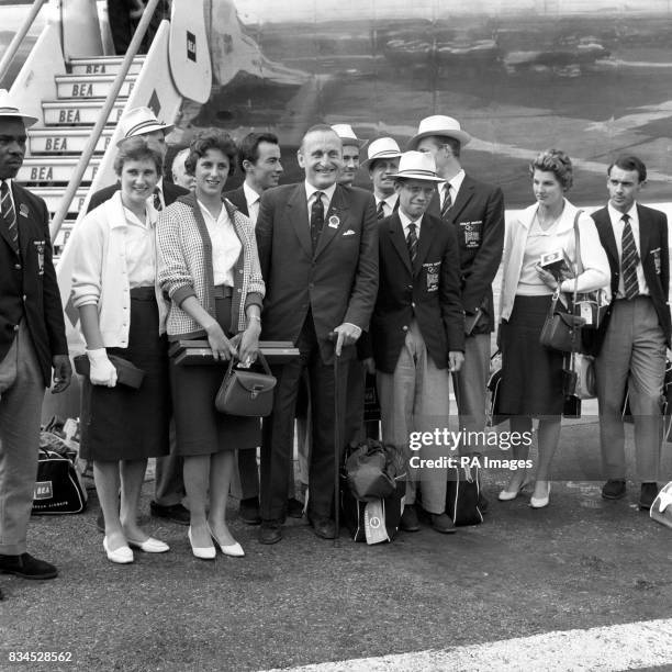 Some of the British medallists pictured upon their arrival at London Airport: High jumper Dorothy Shirley , 100m runner Dorothy Hyman , Lord...