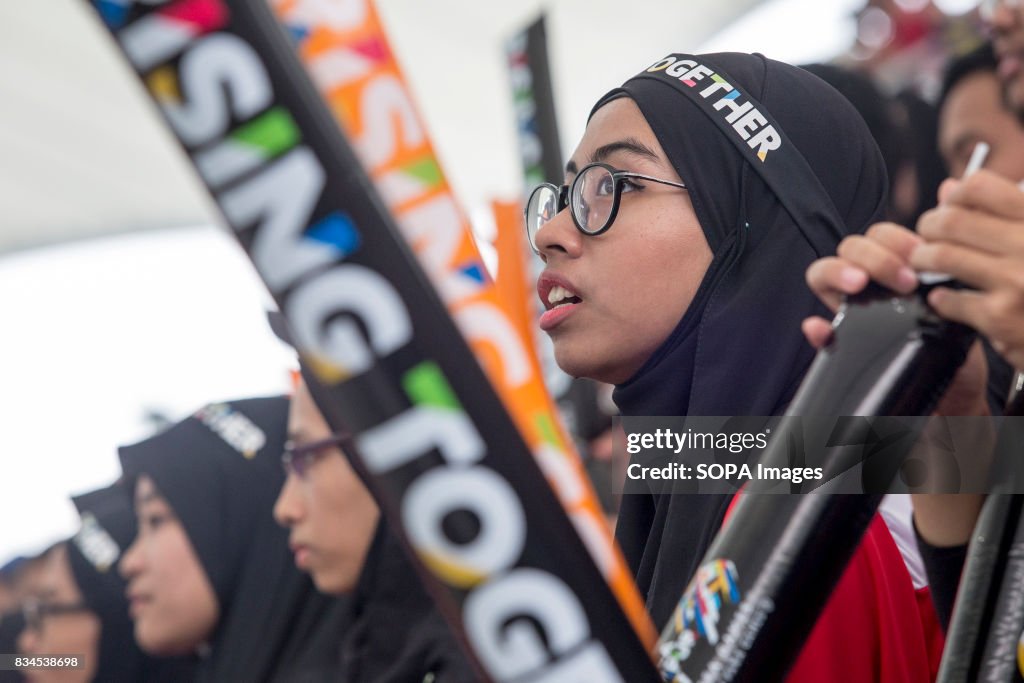 A Malaysian supporter cheers during the Malaysia - Thailand...