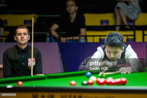 Zhou Yuelong of China plays a shot during his second round match against Mark Selby of England on day three of Evergrande 2017 World Snooker China...