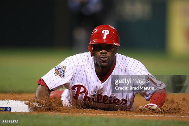 Jimmy Rollins of the Philadelphia Phillies slides back to first base in the bottom of the fourth inning during game four of the World Series between...