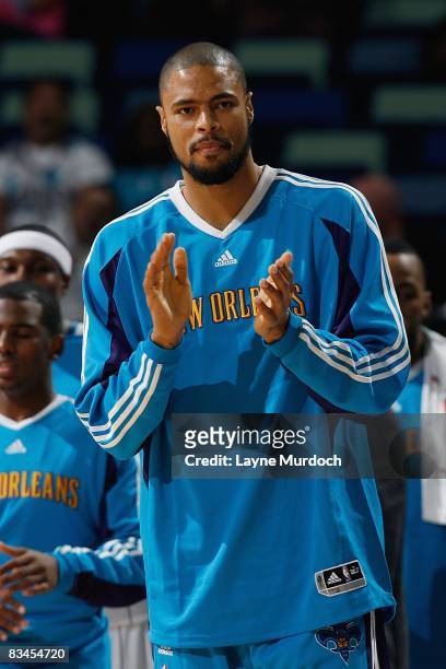 Tyson Chandler of the New Orleans Hornets celebrates on the sidelines during the preseason game against the Golden State Warriors on October 5, 2008...