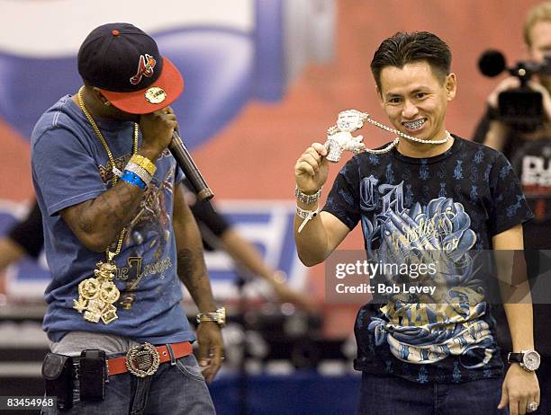 Pistols, left, and jewelry designer Johnny Dang during the Dub Show Tour 2008 Custom Audio Show & Concert at Reliant Arena on August 23, 2008 in...