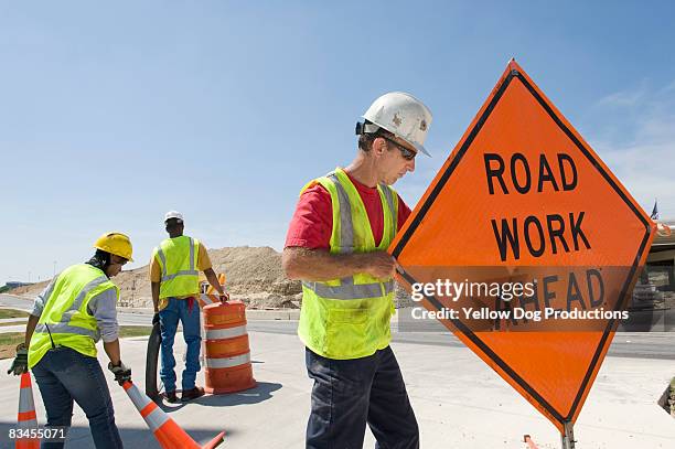 highway construction workers - road construction safety stock pictures, royalty-free photos & images