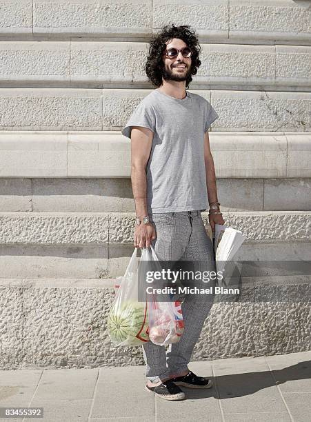 portrait of man with beard in street - carrying bags stock pictures, royalty-free photos & images