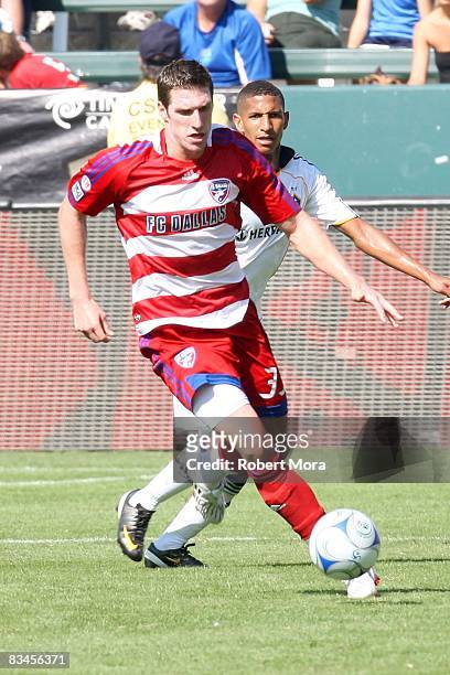 Kenny Cooper of FC Dallas attacks the defense of the Los Angeles Galaxy during their MLS game at Home Depot Center on October 26, 2008 in Carson,...