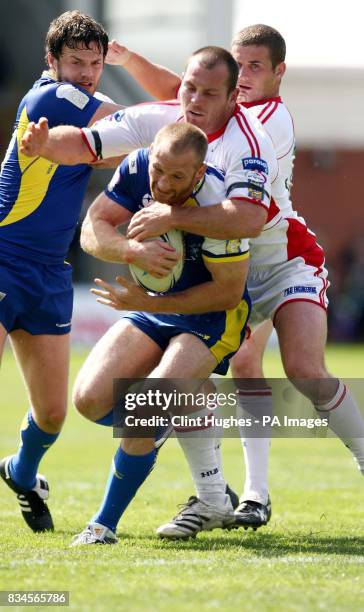 Warrington's Michael Monaghan is tackled by Hull KR's Rhys Lovegrove during the engage Super League match at the Halliwell Jones Stadium, Warrington.