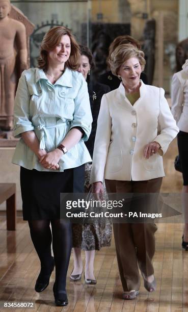 The wife of Britain's Prime Minister, Sarah Brown, left, walks with America's First Lady, Laura Bush, right, during their tour of the British Museum,...