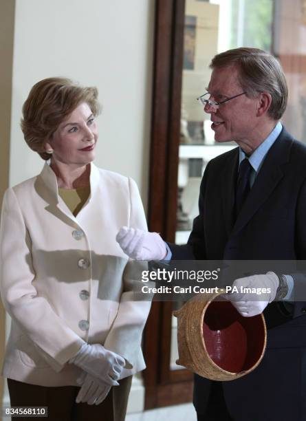 America's First Lady, Laura Bush, left, is shown an ancient artifact in the Afghani and Burmese section of the British Museum by section curator...