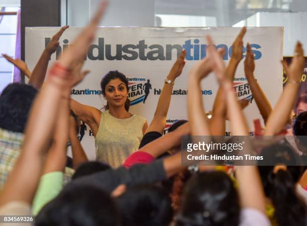 Bollywood actor Shilpa Shetty Kundra teaches yoga during the Hindustan Times Fitter Mumbai Campaign at Gold's Gym, Bandra, on August 12, 2017 in...