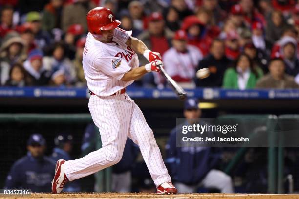 Shane Victorino of the Philadelphia Phillies hits a 2-run single in the bottom of the first inning against the Tampa Bay Rays during game five of the...