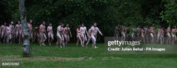 Hundreds of volunteers strip naked in Blarney Castle in Cork for photographer Spencer Tunick.