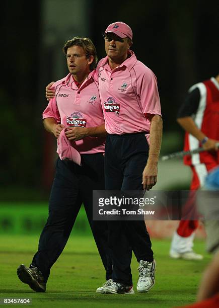 Middlesex captain Shaun Udal walks off dejected with Ed Joyce of Middlesex during the Stanford Twenty20 Super Series match between Trinidad & Tobago...