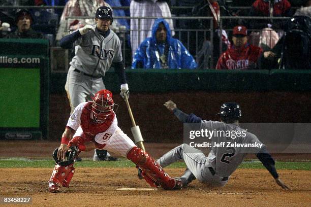 Upton of the Tampa Bay Rays scores on a RBI single by Carlos Pena in the top of the sixth inning against Carlos Ruiz of the Philadelphia Phillies...