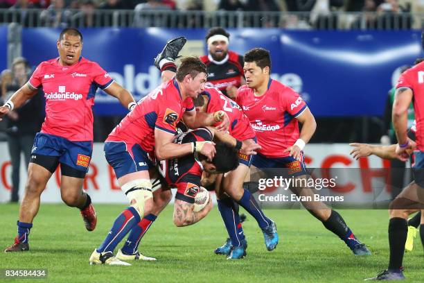 Ethan Blackadder of Tasman tackles Rob Thompson during the during the Mitre 10 Cup round one match between Tasman and Canterbury at Trafalgar Park on...