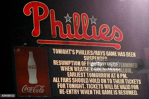 Message on the scoreboard explains that game five of the 2008 MLB World Series between the Philadelphia Phillies and the Tampa Bay Rays has been...