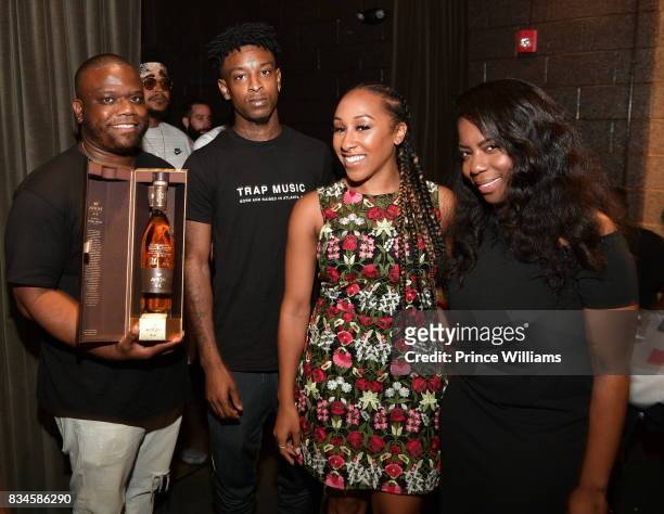 Jason Riddick, 21 Savage and Rachel Jackson attend a an Ascap for Dinnnr for 21 Savage at KR Steakhouse on August 17, 2017 in Atlanta, Georgia.