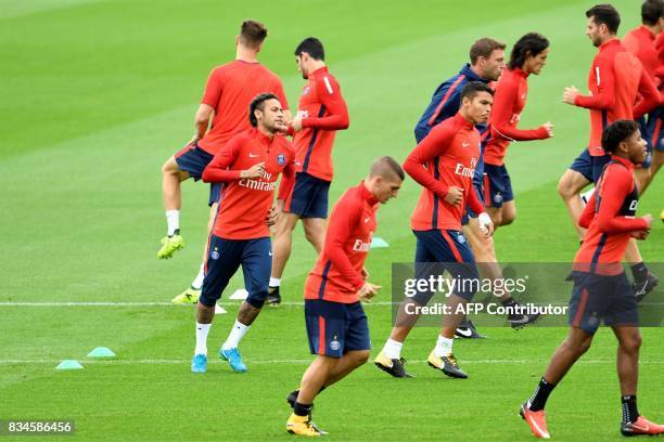 Paris Saint-Germain's Brazilian forward Neymar and teammates take part in a training session at the Camp des Loges in Saint-Germain-en-Laye, near...