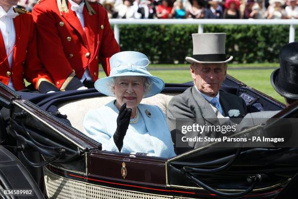 Great Britain's Queen Elizabeth II arrives on ladies day at Ascot Racecourse, Berkshire.