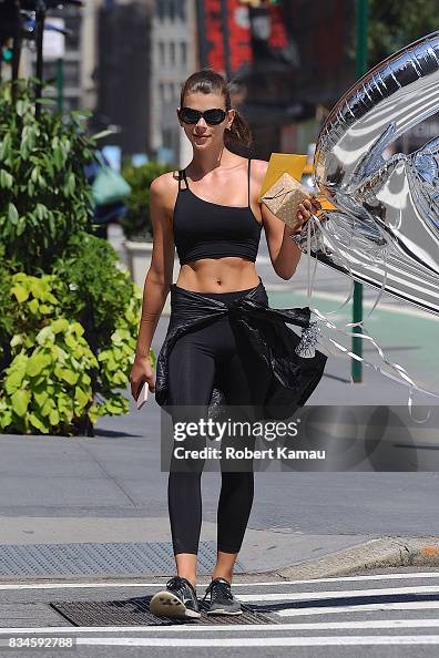 Georgia Fowler holds on to her CK shaped silver balloons as she walks