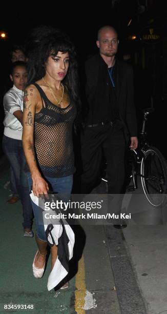Amy Winehouse is seen leaving Dingwalls in Camden and visiting a petrol station to buy a deck of cards on August 14, 2008 in London, England. As she...