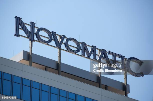 The company logo of Novomatic sits on top of the Novomatic AG headquarters in Gumpoldskirchen, Austria, on Thursday, Aug. 17, 2017. Novomatic is...