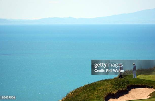 Hunter Mahan of the USA and Anthony Kim of the USA admire the view from the 6th green during The Kiwi Challenge at Cape Kidnappers on October 28,...