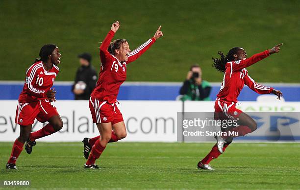 Rachel Lamarre of Canada celebrates her goal with Tiffany Cameron and Amy Harrison of Canada during the FIFA U-17 Women`s World Cup match between New...