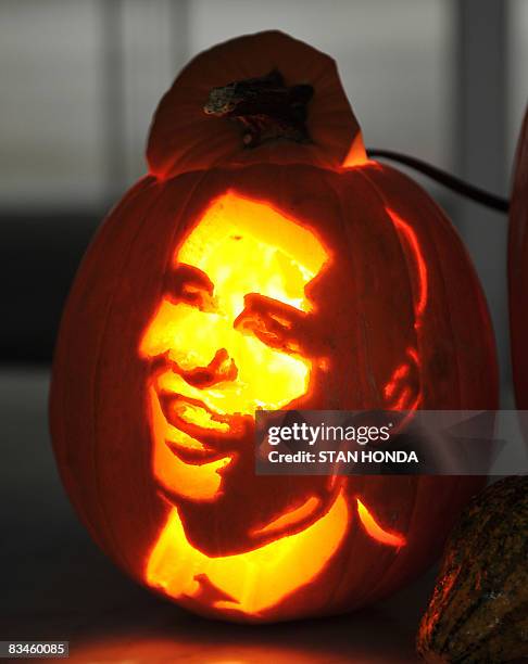 Halloween pumpkin carved with the help of stencils found on the web site "www.yeswecarve.com" October 24, 2008 are displayed at an apartment in New...