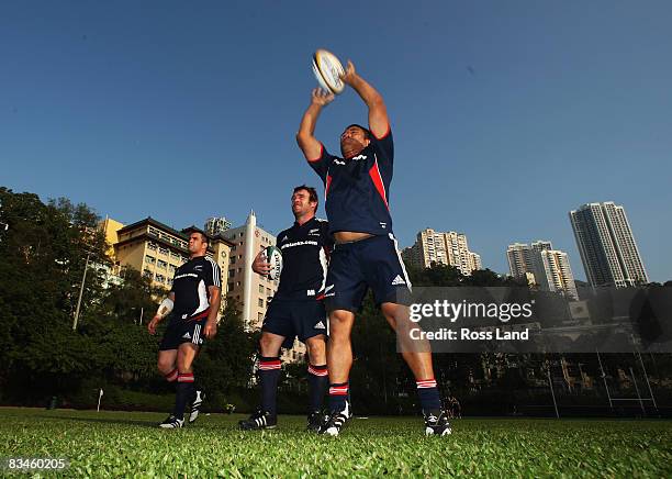 Hookers Cory Flynn, Andrew Hore and Keven Mealamu of the All Blacks practise lineout throws during a New Zealand All Blacks training session at So...