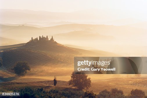 Typical Tuscany landscape with farmhouse in the mist Typical Tuscany landscape with farmhouse in the mist