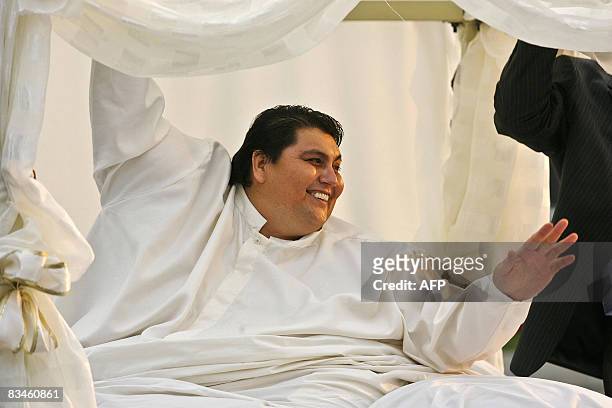 Mexican Manuel Uribe, the world's fattest man in the 2007 Guinness Book of Records, waves as he is driven atop a truck to go to his wedding, on...