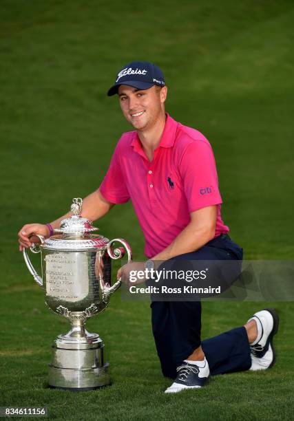 Justin Thomas of the United States poses with the Wanamaker Trophy after winning the 2017 PGA Championship during the final round at Quail Hollow...