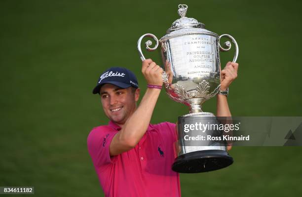 Justin Thomas of the United States poses with the Wanamaker Trophy after winning the 2017 PGA Championship during the final round at Quail Hollow...