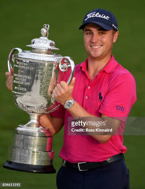 Justin Thomas of the United States poses with the Wanamaker Trophy after winning the 2017 PGA Championship during the final round at Quail Hollow...