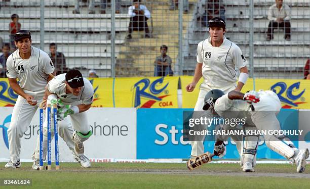 New Zealand wicket keeper Brendon McCullum successfully runs out Bangladeshi batsman Junaed Siddique as New Zealand teammates Ross Taylor and Jamie...