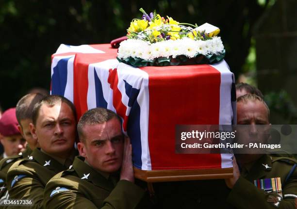 The coffin of Private Daniel Gamble of B Company 2nd Battalion Parachute Regiment is carried by collegues into the Holy Cross Church in Uckfield,...