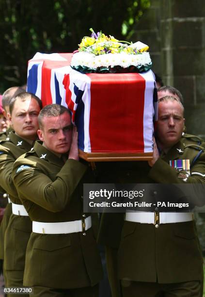 The coffin of Private Daniel Gamble of B Company 2nd Battalion Parachute Regiment is carried by collegues into the Holy Cross Church in Uckfield,...