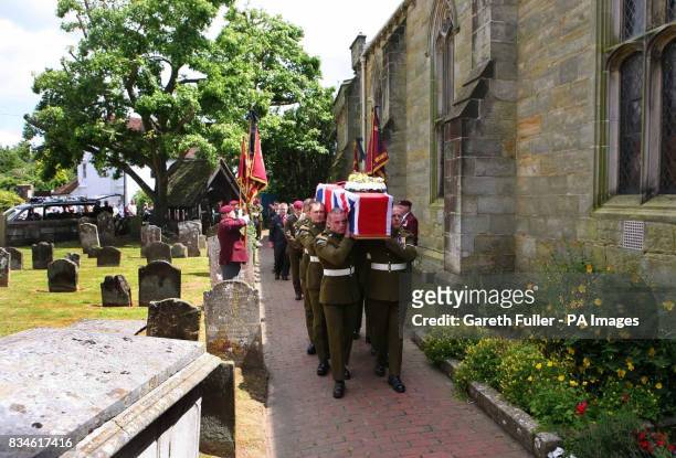 The coffin of Private Daniel Gamble of B Company 2nd Battalion Parachute Regiment is carried by colleagues into the Holy Cross Church in Uckfield,...