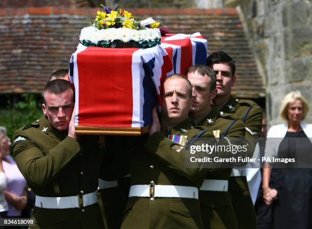 The coffin of Private Daniel Gamble of B Company 2nd Battalion Parachute Regiment is carried by collegues into the Holy Cross Church in Uckfield,...