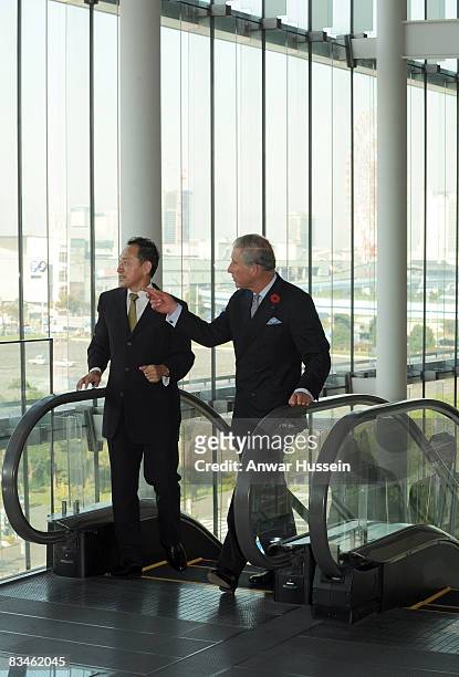 Prince Charles, Prince of Wales, accompanied by Mamoru Mori, executive director and former astronaut, tours the Emerging Museum of Science and...