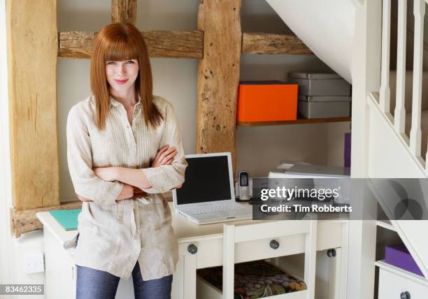 portrait of young business woman in home office - bang palabra en inglés fotografías e imágenes de stock