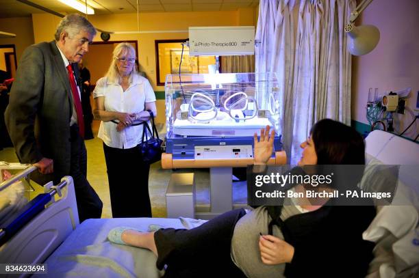 Mum Rachel Longley with her new baby girl, Hannah Longley in her incubator being treated for jaundice, chats with First Minister of the National...