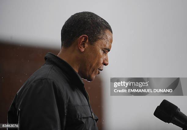 Democratic presidential candidate Illinois Senator Barack Obama speaks as rain falls during a rally at Widener University in Chester, Pennsylvania,...