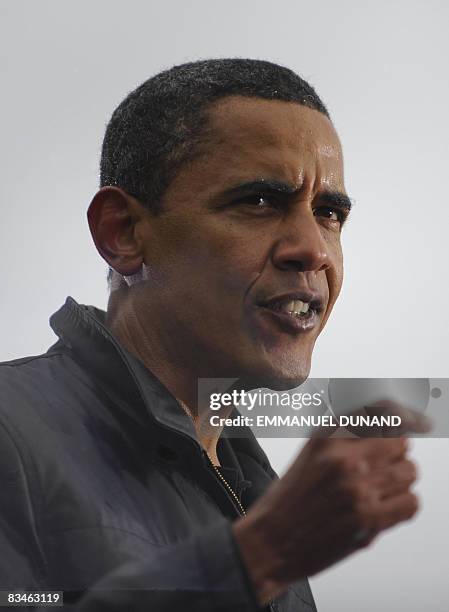 Democratic presidential candidate Illinois Senator Barack Obama speaks as rain falls during a rally at Widener University in Chester, Pennsylvania,...