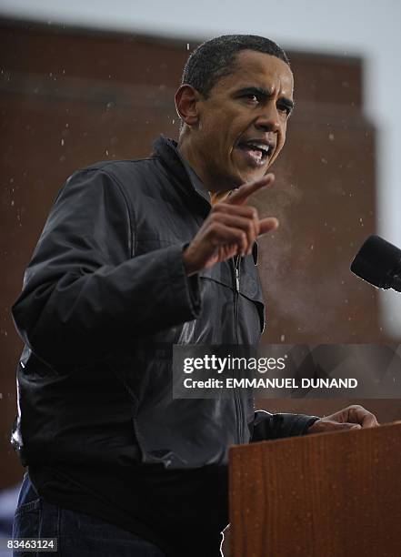 Democratic presidential candidate Illinois Senator Barack Obama speaks as rain falls during a rally at Widener University in Chester, Pennsylvania,...