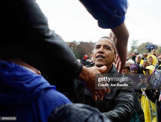 Democratic presidential nominee U.S. Sen. Barack Obama shakes hands with people during a campaign rally at Widener University Main Quad October 28,...