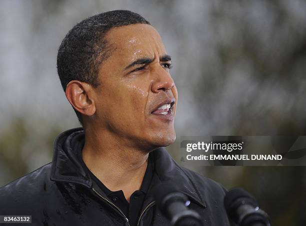 Democratic presidential candidate Illinois Senator Barack Obama speaks as rain falls during a rally at Widener University in Chester, Pennsylvania,...